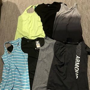 7 athletic shirts. All small except bottom right under armour is medium